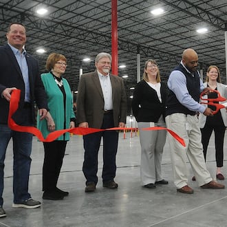 Legrand officials and well-wishers celebrate the opening on the its Union distribution center on Feb. 23, 2023. STAFF