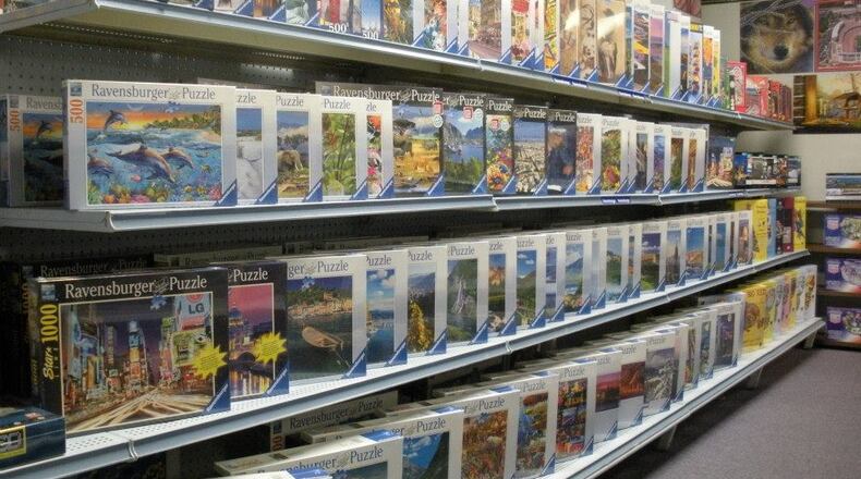 The Puzzles Plus store at The Greene Town Center is offers a variety of jigsaw puzzles and brain-teaser games and books to help ease cabin fever during the coronavirus shelter-at-home order.