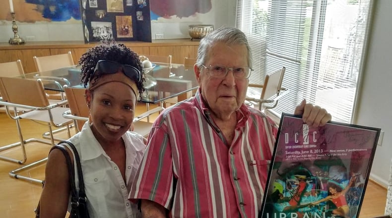 In celebration of Clayton resident Harold Prigozen’s 100th birthday May 14, dancer Sheri “Sparkle” Williams gave him a concert poster signed by DCDC dancers.