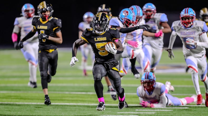 Meadowdale High School sophomore Dominick Ramsey breaks free for a touchdown during their game against Belmont on Wednesday night at Dayton Welcome Stadium. The Lions won 22-2. Michael Cooper/CONTRIBUTED