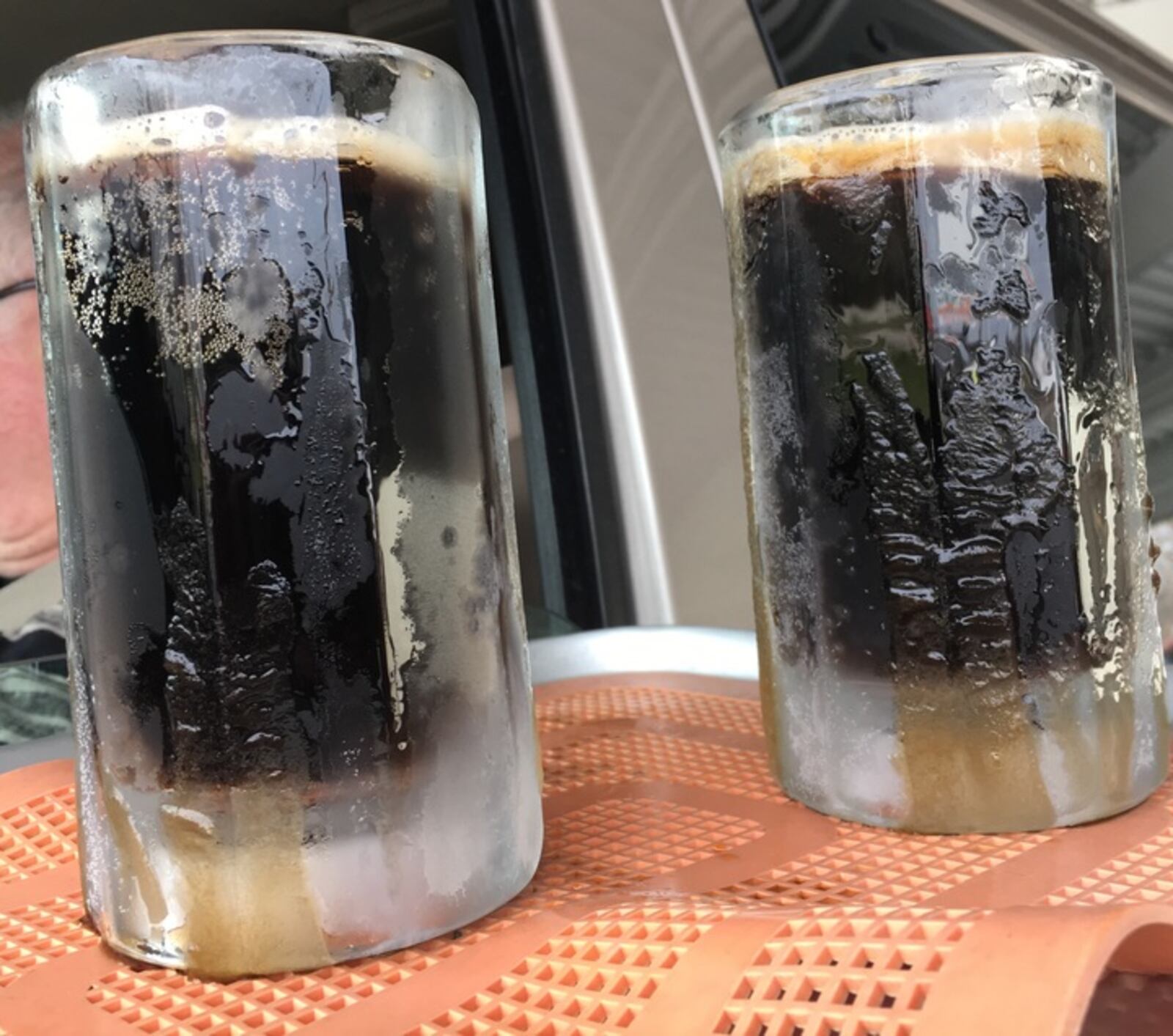 Two big icy mugs of root beer floats are perfect to wash down a cheeseburger or hot dog.