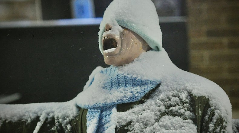 Snow and cold weather Friday morning January 19, 2024, has even the mannequin in front of the Foy's store in Fairborn screaming. MARSHALL GORBY\STAFF
