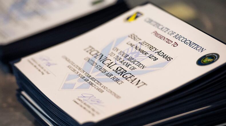 Certificates for Team Wright-Patt’s newest technical sergeant selects are stacked on a table during the release party June 30 inside the Hope Hotel near Wright-Patterson Air Force Base. U.S. AIR FORCE PHOTO/WESLEY FARNSWORTH