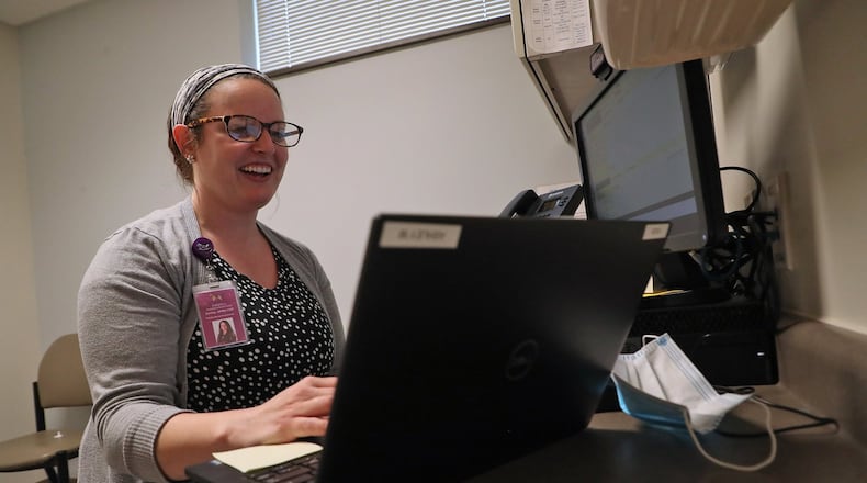 In 2020, Nurse Practitioner Ashley Mowen spoke with a patient on the computer during a telehealth visit at the Rocking Horse Center. BILL LACKEY/STAFF
