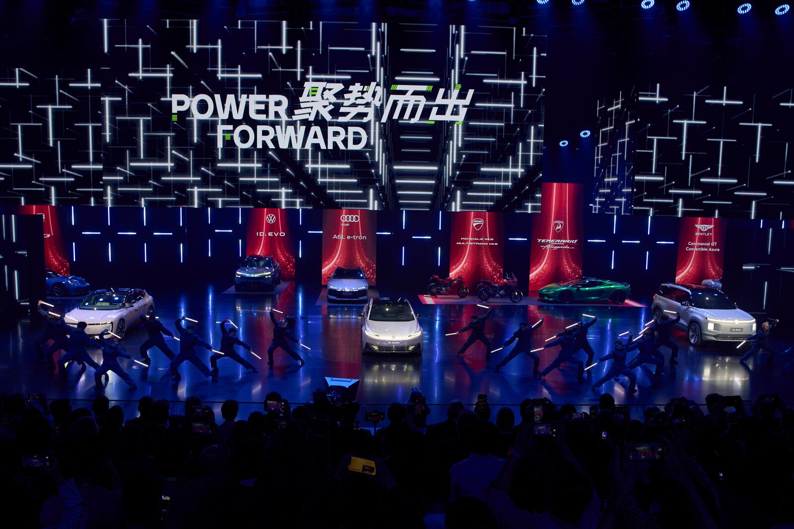 Performers take part in the Volkswagen Group media night ahead of the Auto Show in Shanghai, Tuesday, April 22, 2025. (AP Photo/Ng Han Guan)