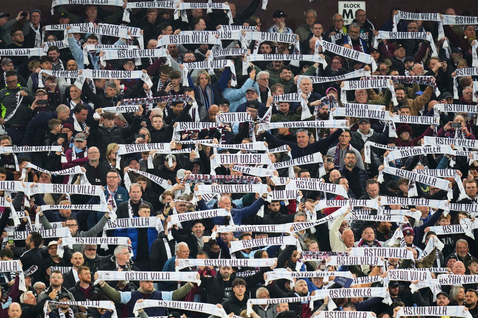 Aston Villa fans cheer ahead of the Champions League quarterfinal second leg soccer match between Aston Villa and Paris Saint-Germain at Villa Park stadium, Birmingham, England, Tuesday, April 15, 2025. (AP Photo/Kirsty Wigglesworth)