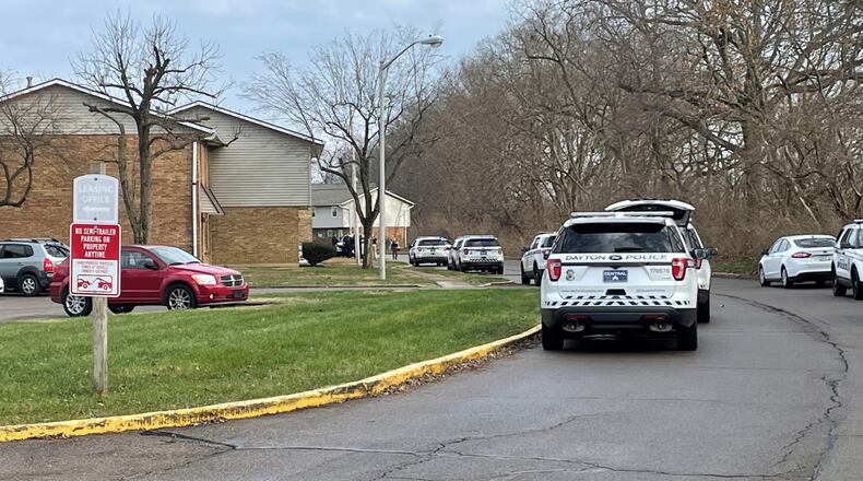 Multiple Dayton police crews responded to apartment buildings on Southshore Drive on Friday, Dec. 31, 2021. PARKER PERRY / STAFF