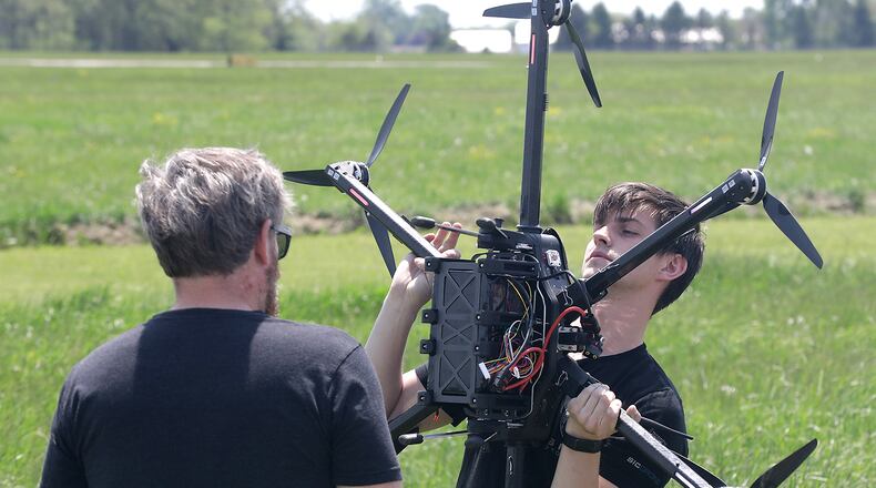 Gus Meyer, a drone pilot at SIC Drones, calibrates one of the company's UAV's at the Springfield Beckley Municipal Airport Thursday, May 12, 2022. BILL LACKEY/STAFF