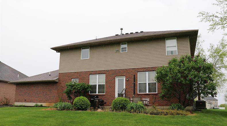 A glass door off the breakfast room opens to the rear patio and deep back yard.