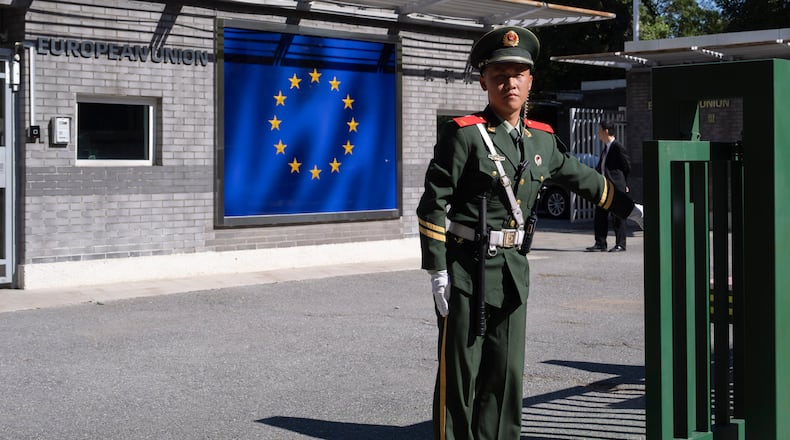 FILE - A Chinese paramilitary policeman stands guard at the entrance to the European Union Delegation to China compound in Beijing, China, on Oct. 14, 2023. (AP Photo/Ng Han Guan, File)