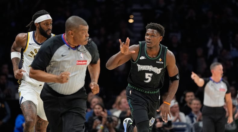 Minnesota Timberwolves guard Anthony Edwards (5) gestures after making a basket during the first half of an NBA basketball game against the Indiana Pacers, Sunday, Oct. 26, 2025, in Minneapolis. (AP Photo/Abbie Parr)