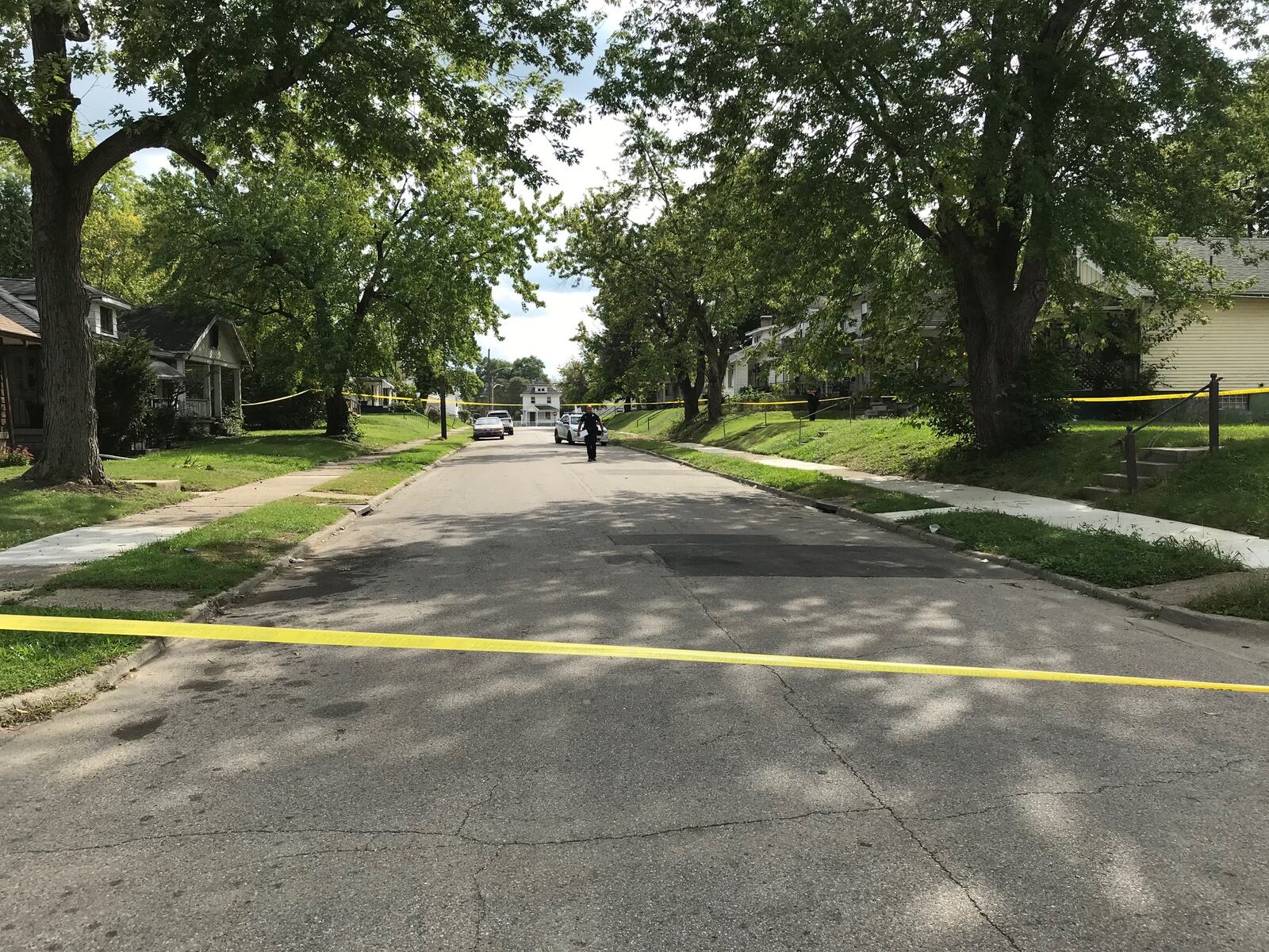 Police have blocked a portion of Shoop Avenue in Dayton after a man was shot and taken to an area hospital. Police are investigating if the shooting happened at this location. (Eric Higgenbothem/Staff)