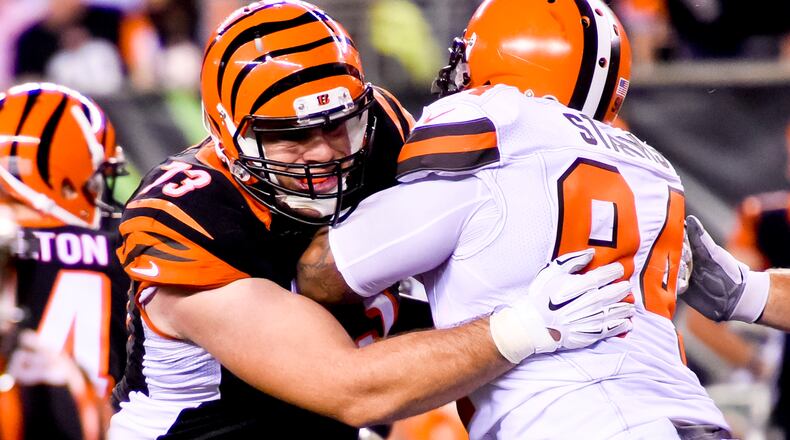 Cincinnati Bengals offensive tackle Eric Winston (73) stands up Cleveland Browns defensive end Randy Starks (94) during the Bengals’ 31-10 win Thursday, Nov. 5 at Paul Brown Stadium in Cincinnati. The Bengals are now 8-0 on the season. NICK GRAHAM/STAFF