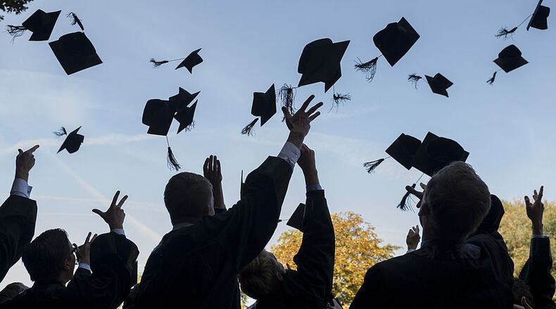 Graduates in an Iowa town held the commencement ceremony at the high school football field.