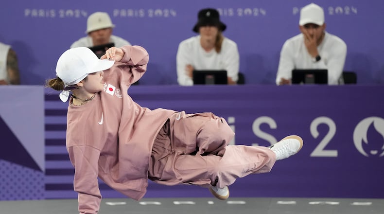Ami Yuasa of Japan, known as Ami, performs in the b-girls breaking competition final against Dominika Banevic of Lithuania, known as Nicka, during the Paris Summer Olympics, at Place de la Concorde in Paris, France, on Friday, August 9th, 2024. Ami won gold in the event. (Chang W. Lee/The New York Times)