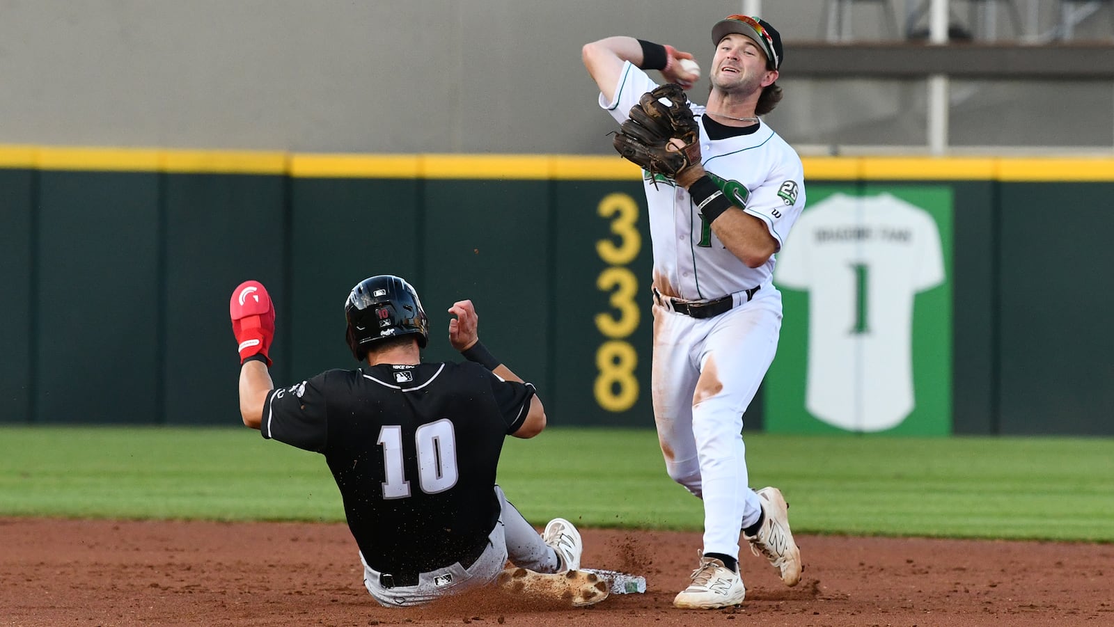 Second baseman Peyton Stovall turns a double play in the second inning Tuesday night at Day Air Ballpark. JEFF GILBERT/CONTRIBUTED