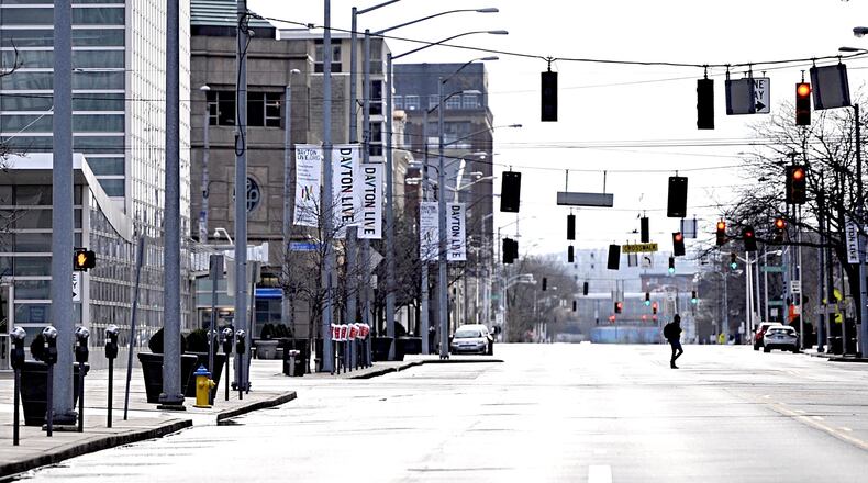 Violation of a mandatory stay-at-home order could result in fines, jail time or both. Due to the coronavirus, Second Street in downtown Dayton already appeared deserted Friday morning. MARSHALL GORBY / STAFF