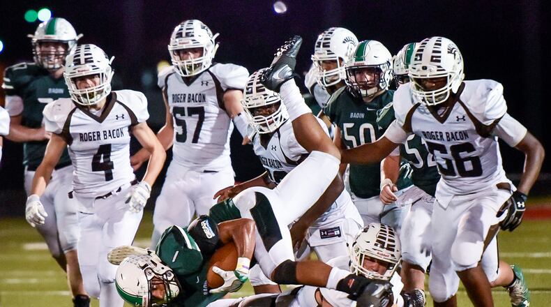 Badin’s Davon Starks gets inverted as he carries the ball during their game against Roger Bacon Friday, Sept. 22 at Fairfield Stadium in Fairfield. The Rams won 41-21. NICK GRAHAM/STAFF