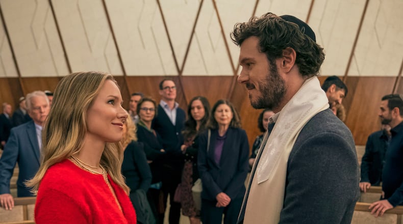 This image released by Netflix shows Kristen Bell, left, and Adam Brody in a scene from "Nobody Wants This." (Stefania Rosini/Netflix via AP)