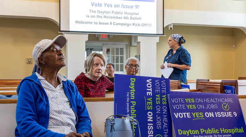 Volunteers in support of the passage of Issue 9 listen during a meeting on Tuesday, Sept. 23 at College Hill Community Church on Philadelphia Drive in western Dayton. If passed, the levy would raise $2 million in support of a new public hospital in West Dayton. BRYANT BILLING / STAFF