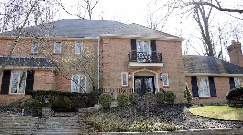 The brick 2-story at 910 Runnymede Road has about 4,280 sq. ft. of living space plus the finished lower level. The house sits nestled within a hillside with a paved driveway that leads up to the 3-car garage. CONTRIBUTED PHOTO BY KATHY TYLER