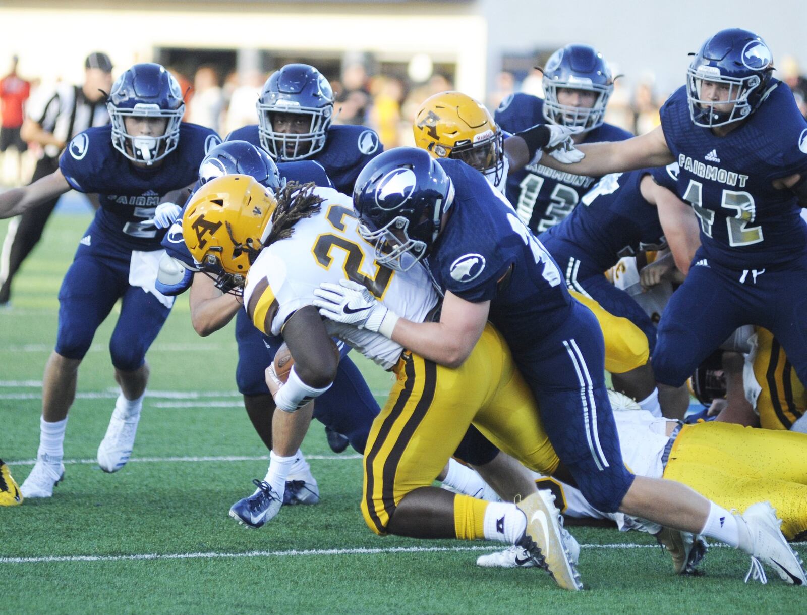 Fairmont’s Jonas Smith takes down Alter running back Branden McDonald. Fairmont defeated visiting Alter 12-6 in a Week 1 high school football opener on Thu., Aug. 23, 2018. MARC PENDLETON / STAFF