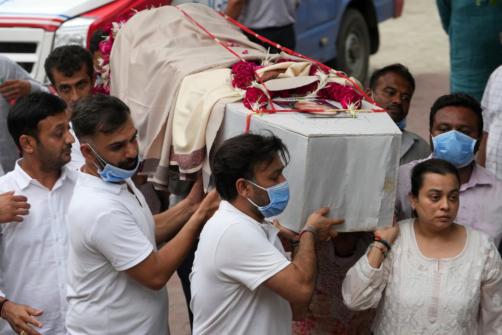 Family members carry coffin of Meena Patel, victim of the Air India plane crash, during his cremation at a crematorium in Ahmedabad, India, Monday, June 16, 2025. (AP Photo/Ajit Solanki)