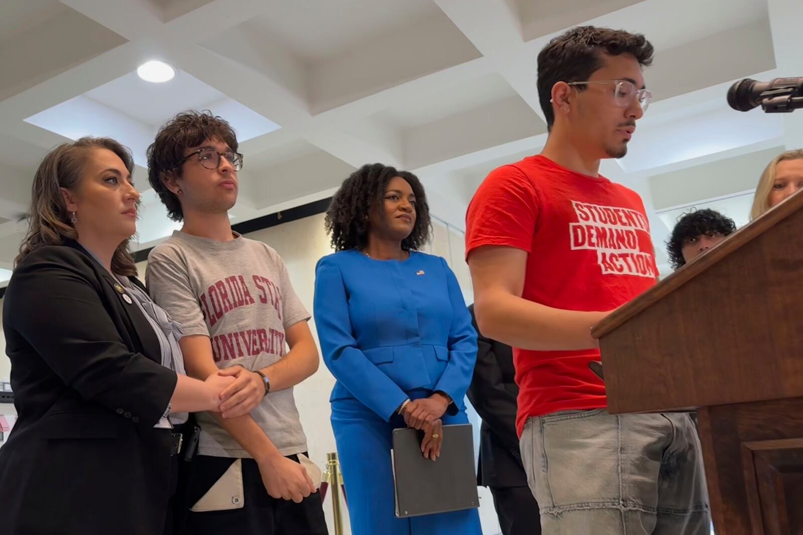 Andres Perez, a 20-year-old junior at Florida State University, speaks at a nes conference in the state capitol in Tallahassee, Fla. alongside Democratic lawmakers. (AP Photo/Kate Payne)