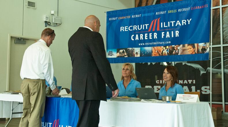 Attendees check-in at a RecruitMilitary job fair held in Cincinnati in 2013. RecruitMilitary is returning with a job fair May 25, 2017, at Paul Brown Stadium. CONTRIBUTED