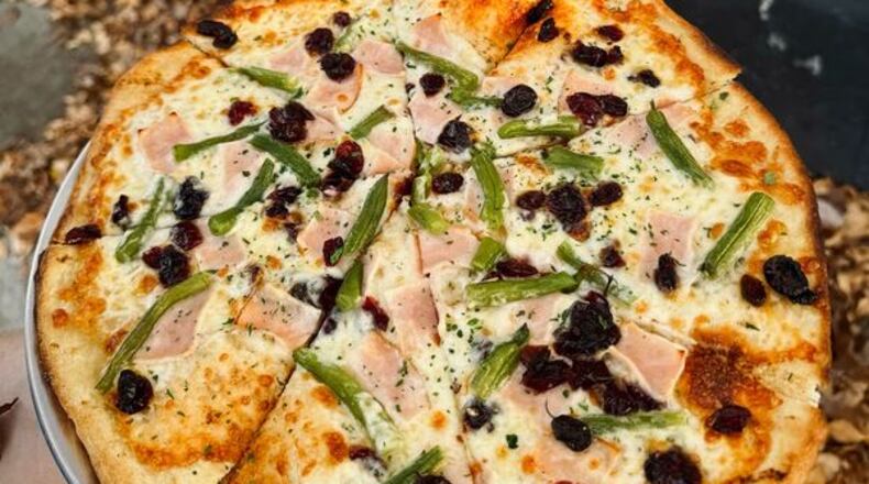 The Ugly Duckling is featuring The Thanksgiving Pie, an olive oil based pizza topped with turkey, green beans and dried cranberries (FACEBOOK PHOTO).