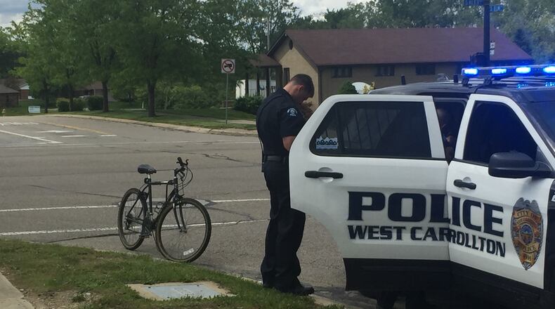 A bicyclist was struck by a car while crossing Elm Street on South Alex Road on Saturday, May 6, 2017, in West Carrollton.