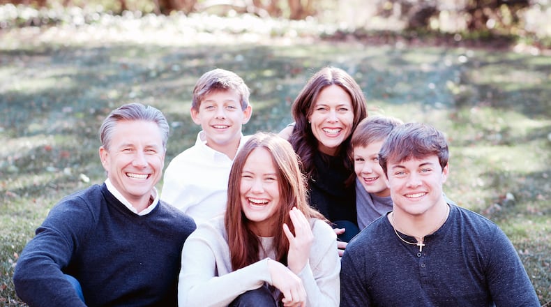 Elizabeth Schaefer (back row) with her family in Kettering (left to right) Husband Rob, son Nate, daughter Annie, Son Dominic and Son Jacob. Growing up in a large Catholic family inspired Schaefer to look for ways to give back and serve her community. CONTRIBUTED