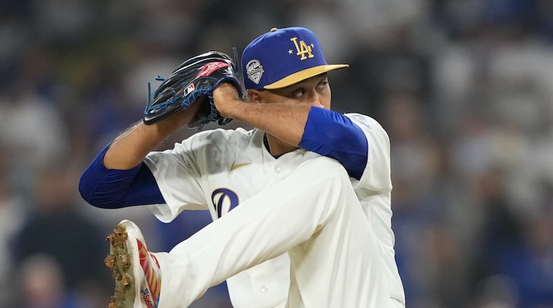 Los Angeles Dodgers relief pitcher Edwin Diaz throws to the plate during the ninth inning of a baseball game against the Arizona Diamondbacks, Friday, March 27, 2026, in Los Angeles. (AP Photo/Mark J. Terrill)