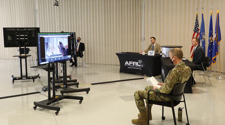 To create a virtual event, a studio-like setting was created for the Air Force Research Laboratory’s Materials and Manufacturing Directorate annual awards ceremony. Left to right: Timothy Sakulich, Dr. Jonathan Spowart, Keith Slinker and Col. Michael Warner. U.S. AIR FORCE PHOTO/SPENCER DEER