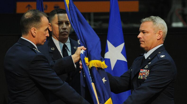 Lt. General Shaun Morris, left, passes the 88th Air Base Wing flag to Colonel Chris Meeker, during a change of command ceremony at the National Museum of the United States Air Force, Thursday, July 7, 2022. MARSHALL GORBY