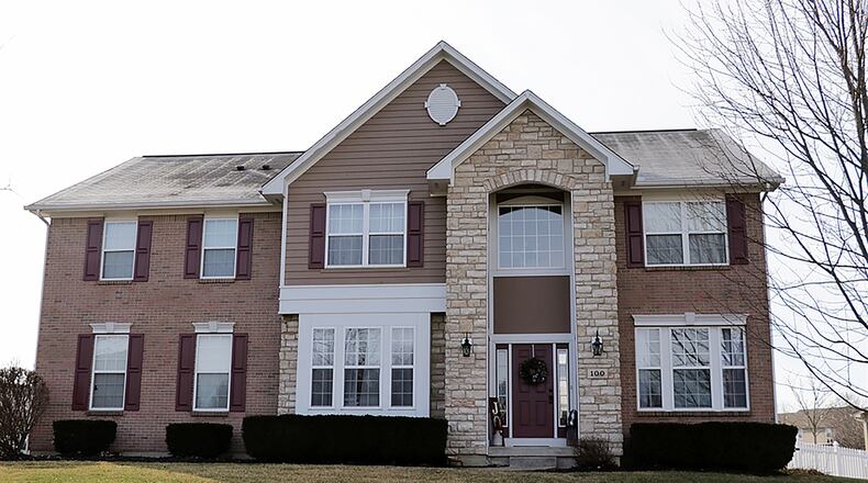 The brick, stone and frame house has about 2,615 sq. ft. of living space plus a finished basement. The house sits diagonally on a corner lot and is within walking distance of community areas. Formal entry opens into a 2-story foyer with hardwood flooring. CONTRIBUTED PHOTO BY KATHY TYLER
