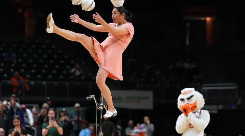 Red Panda performs as Miami's mascot Sebastian the Ibis looks on during halftime of an NCAA college basketball game between Miami and Stanford in Coral Gables, Fla., Wednesday, Jan. 28, 2026. (AP Photo/Rebecca Blackwell)