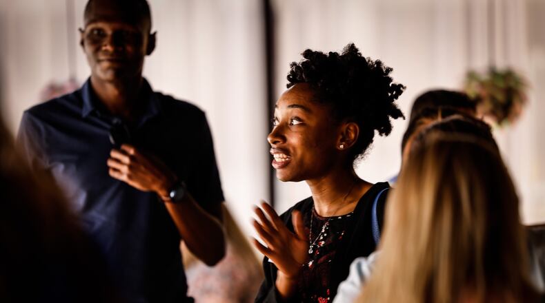 Jacqueline Richardson talks with like minded people at Generation Dayton's first monthly mixer since the pandemic. Generation Dayton is apart of the Dayton Chamber of Commerce to keep talented young professionals in Dayton. Jim Noelker/Staff