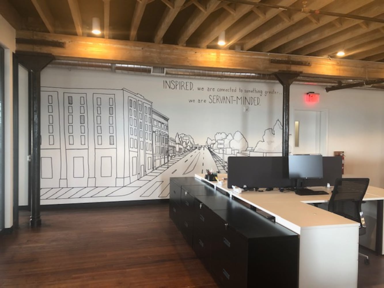 PHOTOS: Inside the new downtown Dayton office that has an industrial slide