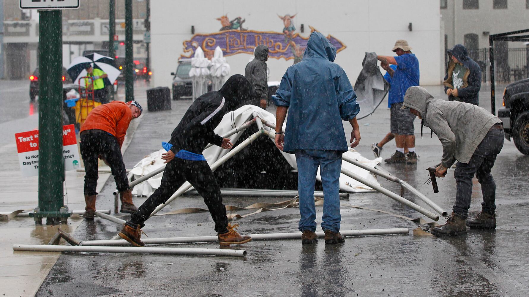 PHOTOS: Crews, party guests work to clean up Oregon District after Gem City Shine block party