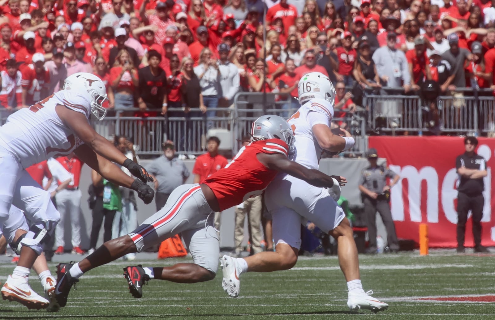 Ohio State's Arvell Reese sacks Texas quarterback Arch Manning on Saturday, Aug. 30, 2025, at Ohio Stadium in Columbus. David Jablonski/Staff
