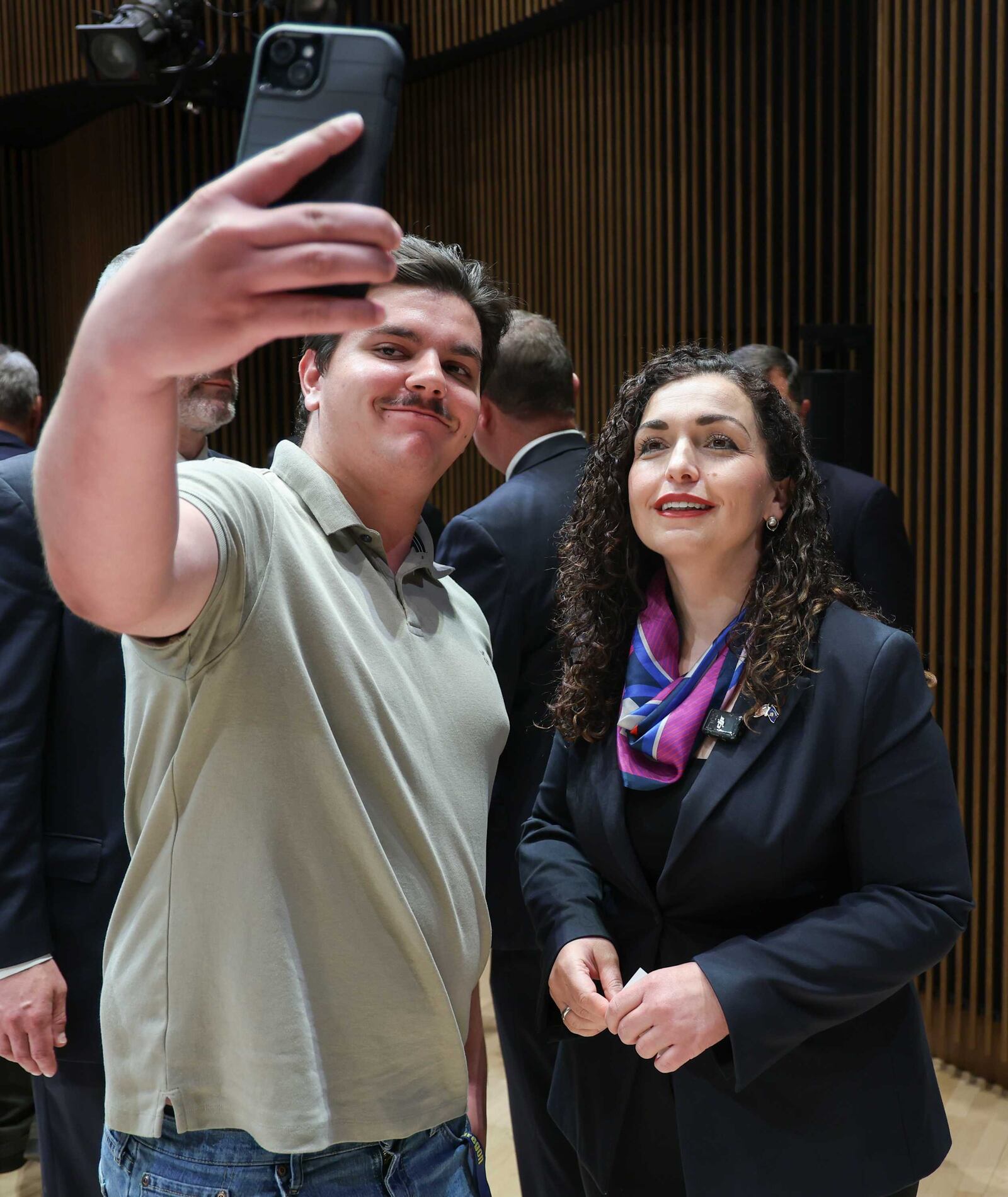 H.E. Dr. Vjosa Osmani, President of Kosovo, poses for a picture with a spectator at a forum that was a part of the Dayton Dialogues held at the University of Dayton's Roger Glass Center on Sunday. BRYANT BILLING / STAFF