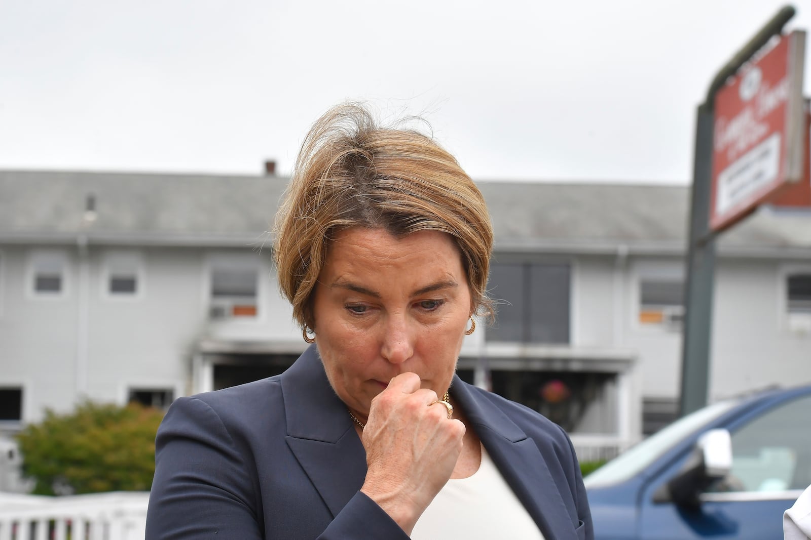 FILE - Massachusetts Gov. Maura Healey approaches a news conference to face reporters, July 14, 2025, near the Gabriel House assisted living facility, behind, following a fire that started late Sunday in Fall River, Mass. (AP Photo/Steven Senne, file)