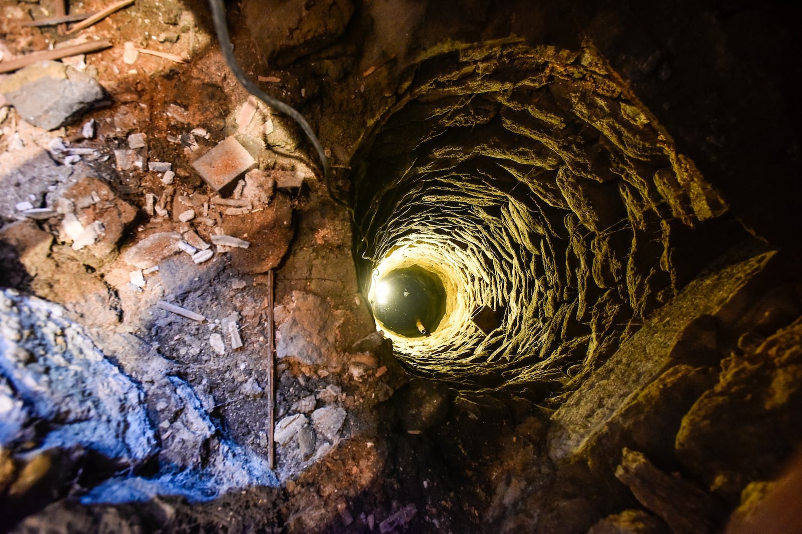Kimberly Bley, who recently purchased a house at 25 South C Street in Hamilton, found a well nearly 25 feet deep underneath the kitchen floor while renovating. NICK GRAHAM/STAFF