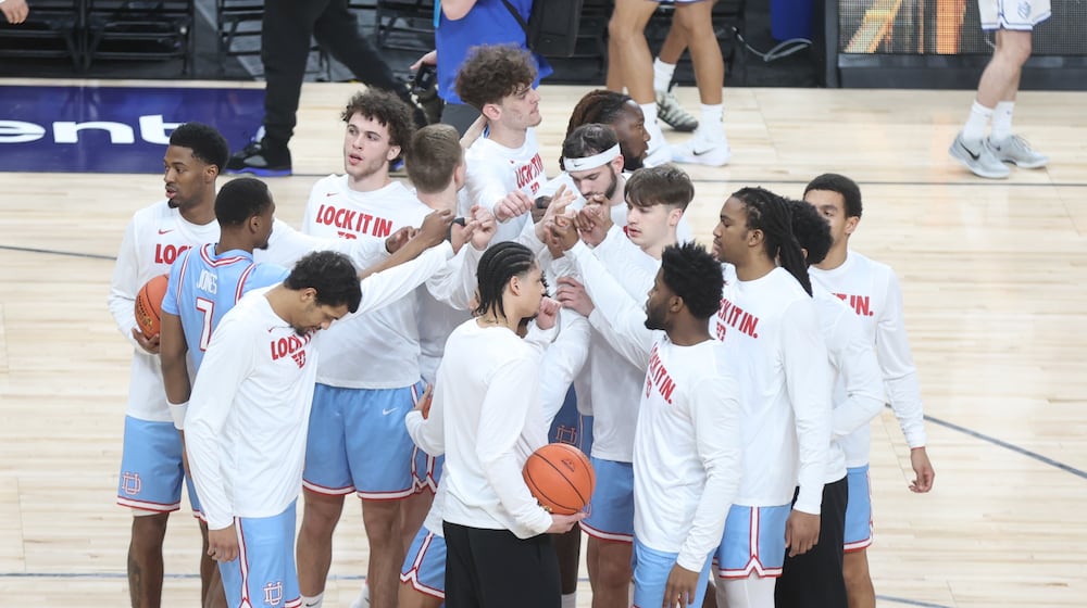 Dayton huddles before a game against Saint Louis in the semifinals of the Atlantic 10 Conference tournament on Saturday, March 14, 2026, at PPG Paints Arena in Pittsburgh. David Jablonski/Staff