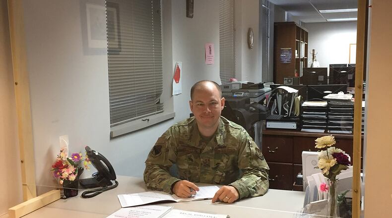 Staff Sgt. Derek Wooten, a paralegal in the 88th Air Base Wing Legal Office, Wright-Patterson Air Force Base, shows on June 16 how the Legal clinic has been modified to protect clients due to the COVID-19 pandemic. Due to the declared public health emergency on base, in-person consultations are limited to specific situations at this time. (Skywrighter photo/Amy Rollins)