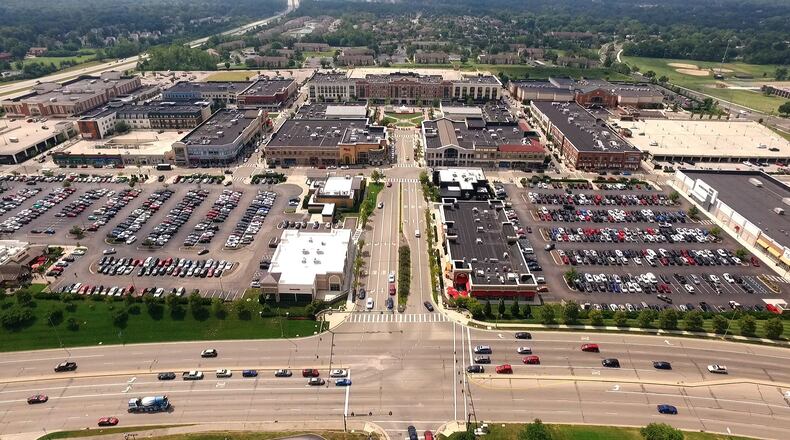 The Greene Town Center in Beavercreek opened in 2006 and is now boasting more than 100 shops and restaurants in the mixed retail open shopping center. TY GREENLEES / STAFF