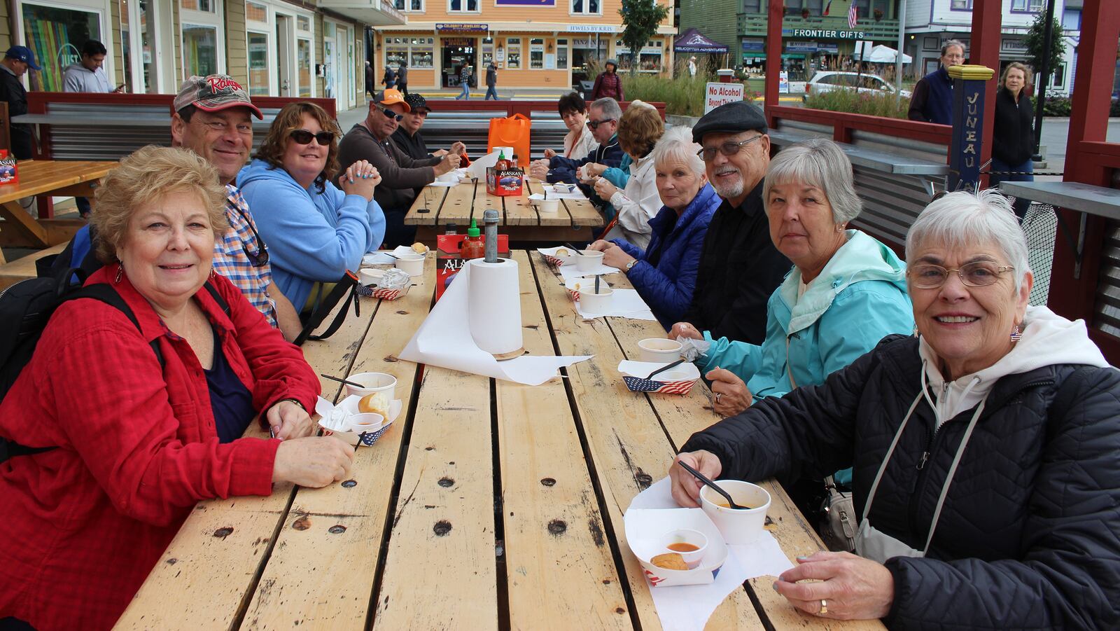 Guests gather at picnic tables to learn more about the foods theyâll be sampling on their Juneau Food Tour. (Juneau Food Tours)