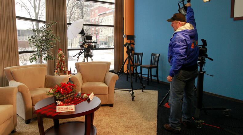 The Dayton TV station RTV has officially relocated to Springfield, with a new studio in the Credit Life Building. General Manager Randall Hulsmeyer turns on the studio lights before an interview. Photo by Barbara J. Perenic/Cox Media Group