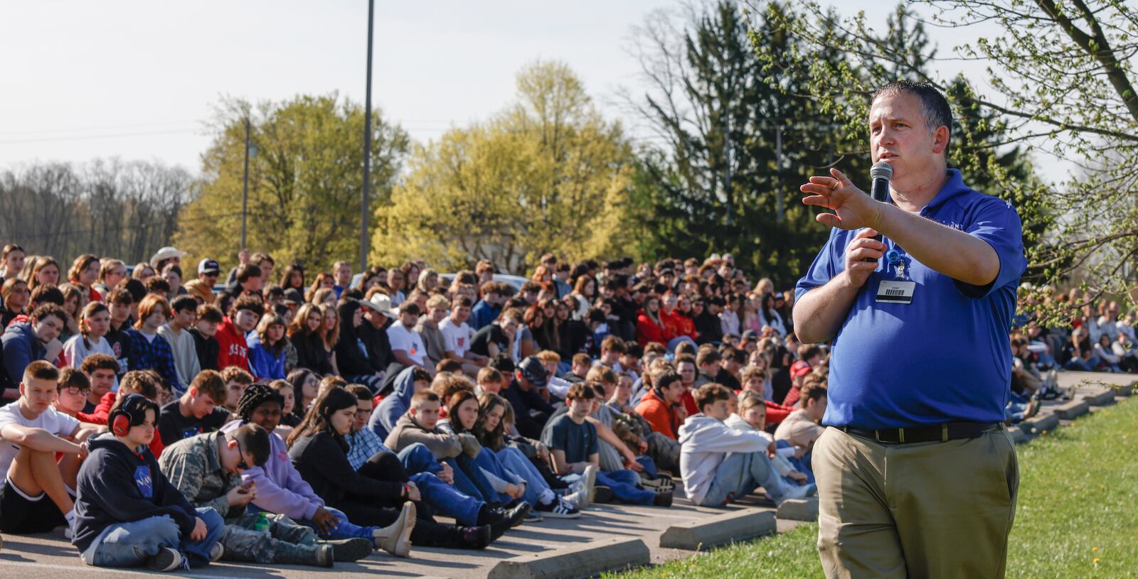 Michael Moyer, flight nurse of Careflight Air & Mobile, speaks to teenagers during a mock crash simulation on Wednesday, April 23, 2025, at Tecumseh High School. The simulation was held to help prevent impaired and distracted driving. JOSEPH COOKE/STAFF